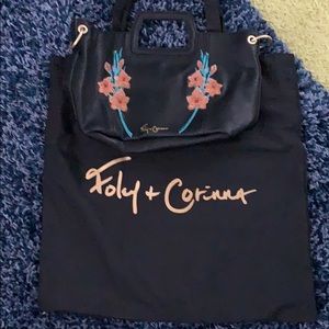 Black with character Foley & Corinna bag